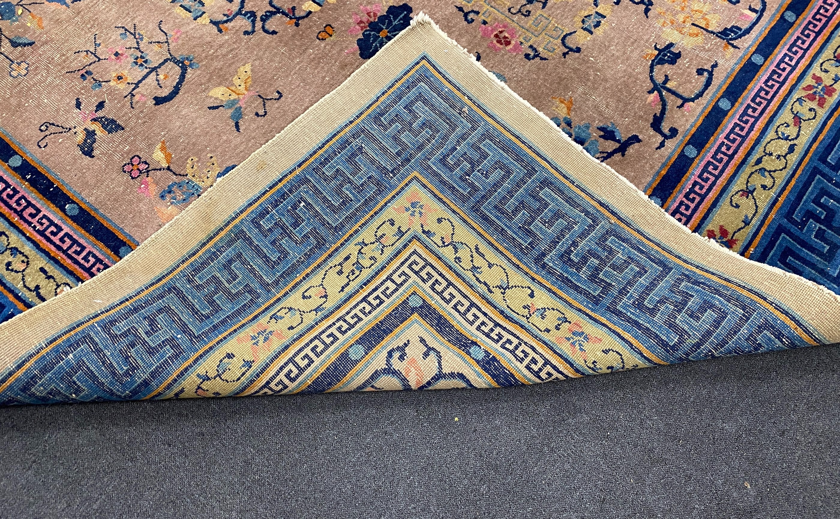 An early 20th century Chinese lilac ground carpet, 330 x 240cm